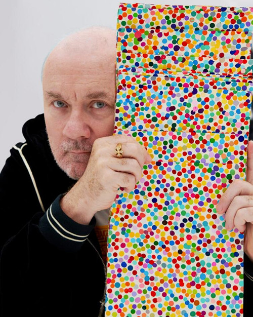 Damien Hirst with works fromThe Currency (2016). Artwork © Damien Hirst and Science Ltd, DACS 2021. Photo: Prudence Cuming Associates Ltd